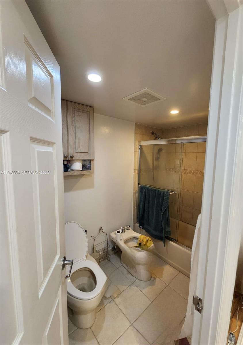 290 174th Street, Unit 1908 Sunny Isles Beach, FL 33160 - Photo 27 of 29 a bathroom with a toilet and a shower