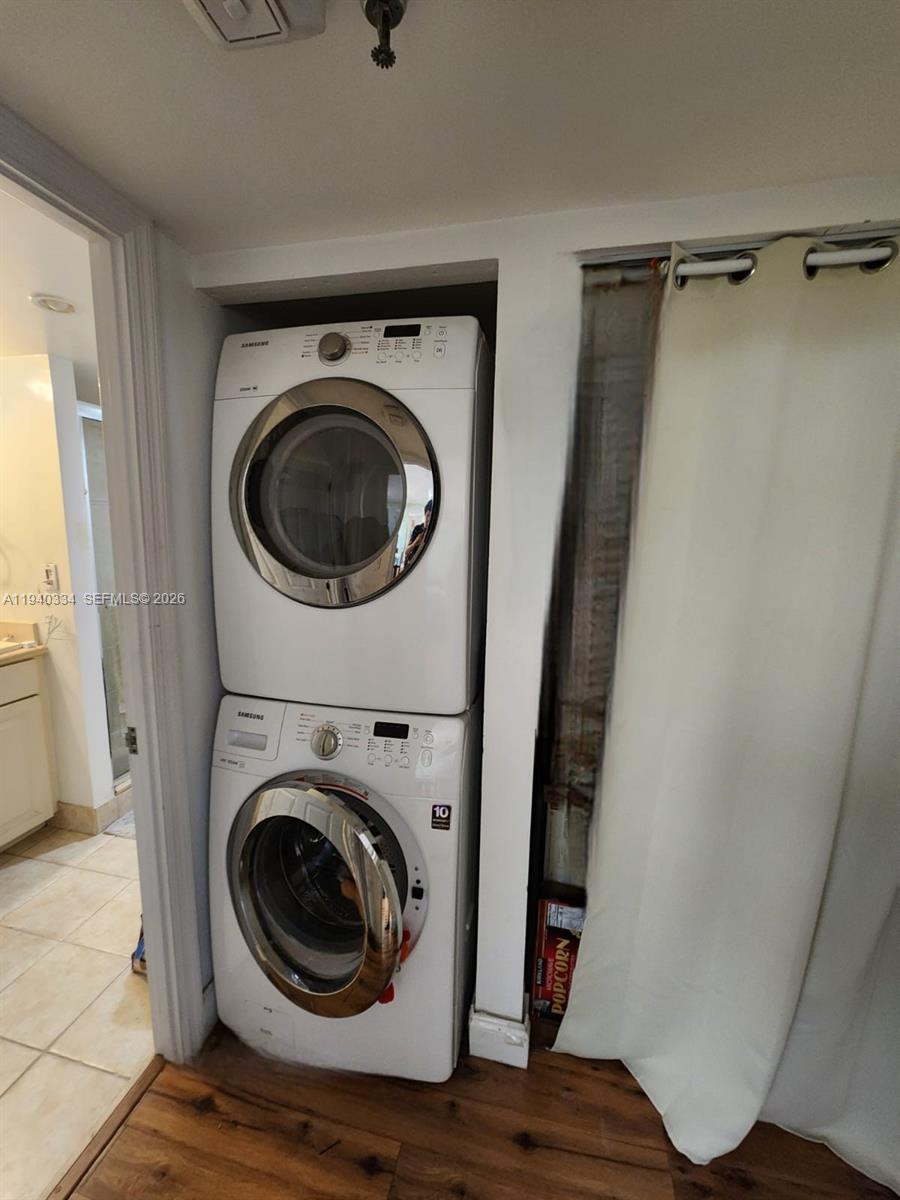 290 174th Street, Unit 1908 Sunny Isles Beach, FL 33160 - Photo 29 of 29 a view of a hallway with washer and dryer