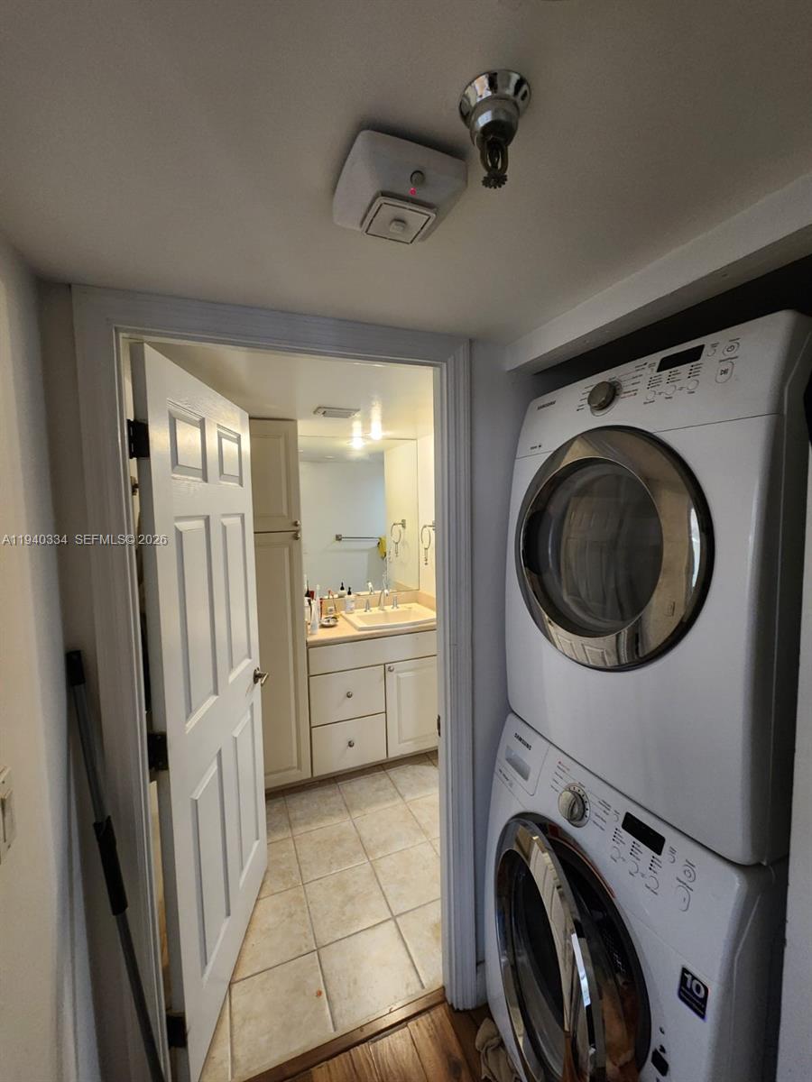 290 174th Street, Unit 1908 Sunny Isles Beach, FL 33160 - Photo 9 of 29 a view of a storage & utility room with washer and dryer