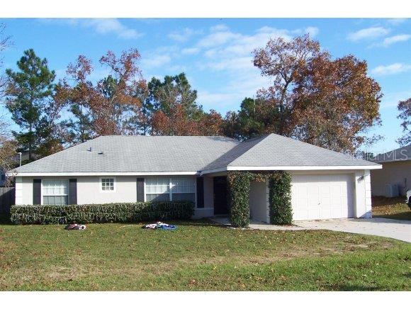 47 Pecan Run Ocala, FL 34472 - Photo 1 of 1 a front view of a house with a yard