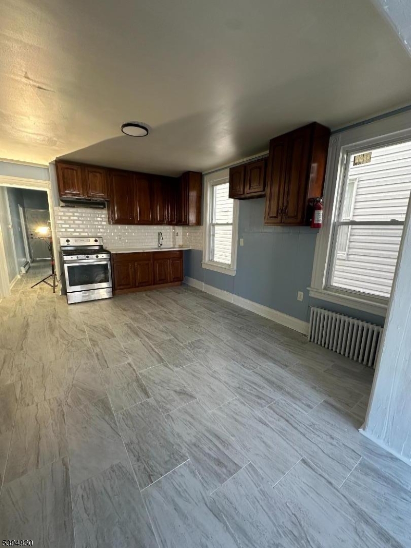 334 11th Avenue, Unit 2 Paterson, NJ 07514 - Photo 3 of 5 a view of kitchen with sink and cabinets