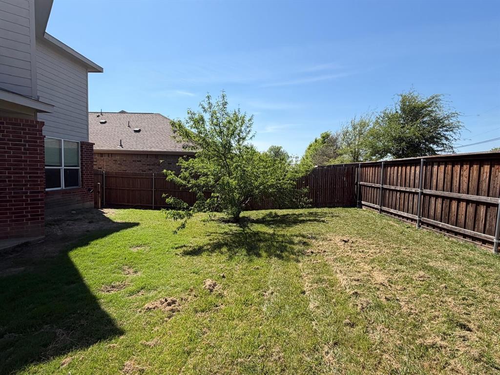 10400 Wagon Rut Court Fort Worth, TX 76108 - Photo 8 of 26 View of fenced backyard
