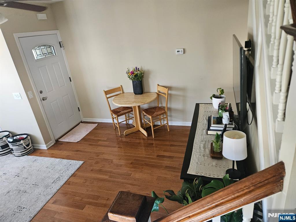 15 William Street, Unit 2 Rochelle Park, NJ 07662 - Photo 5 of 12 a living room with furniture and a wooden floor