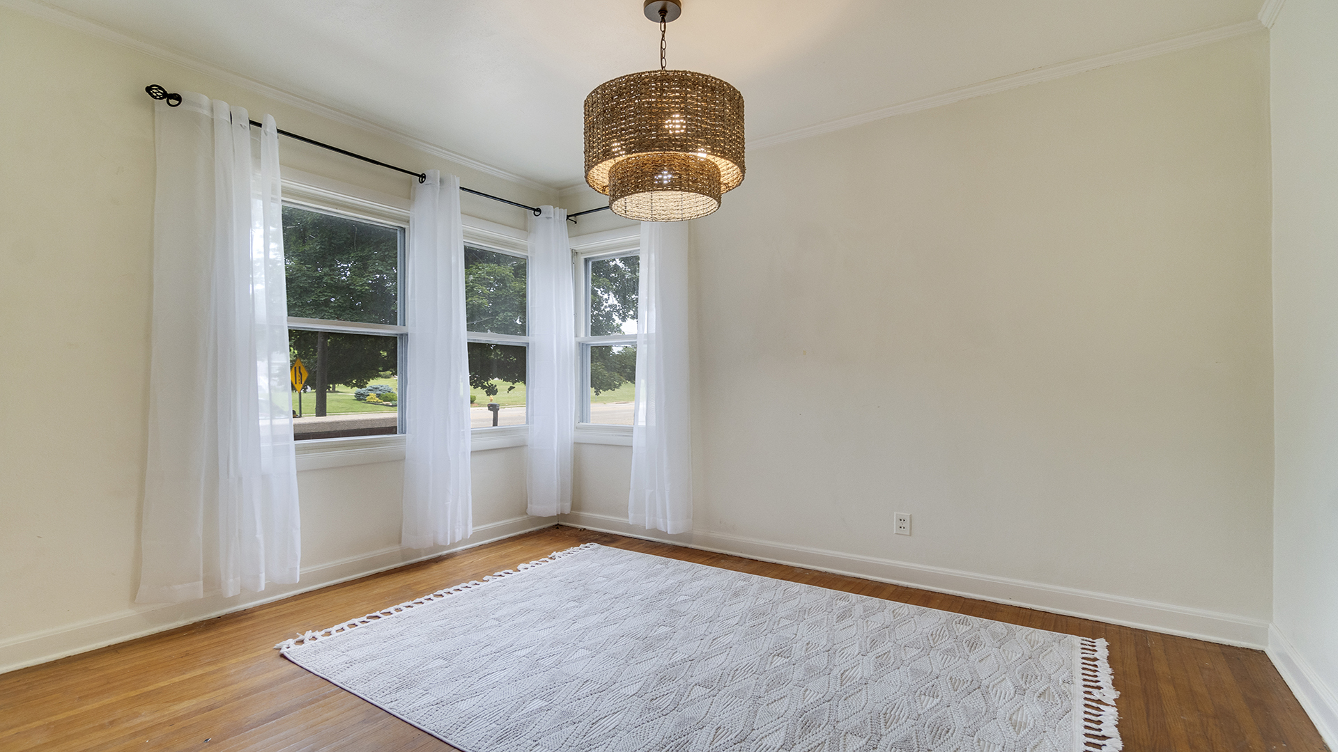 896 Franklin Grove Road Dixon, IL 61021 - Photo 7 of 26 an empty room with wooden floor and windows