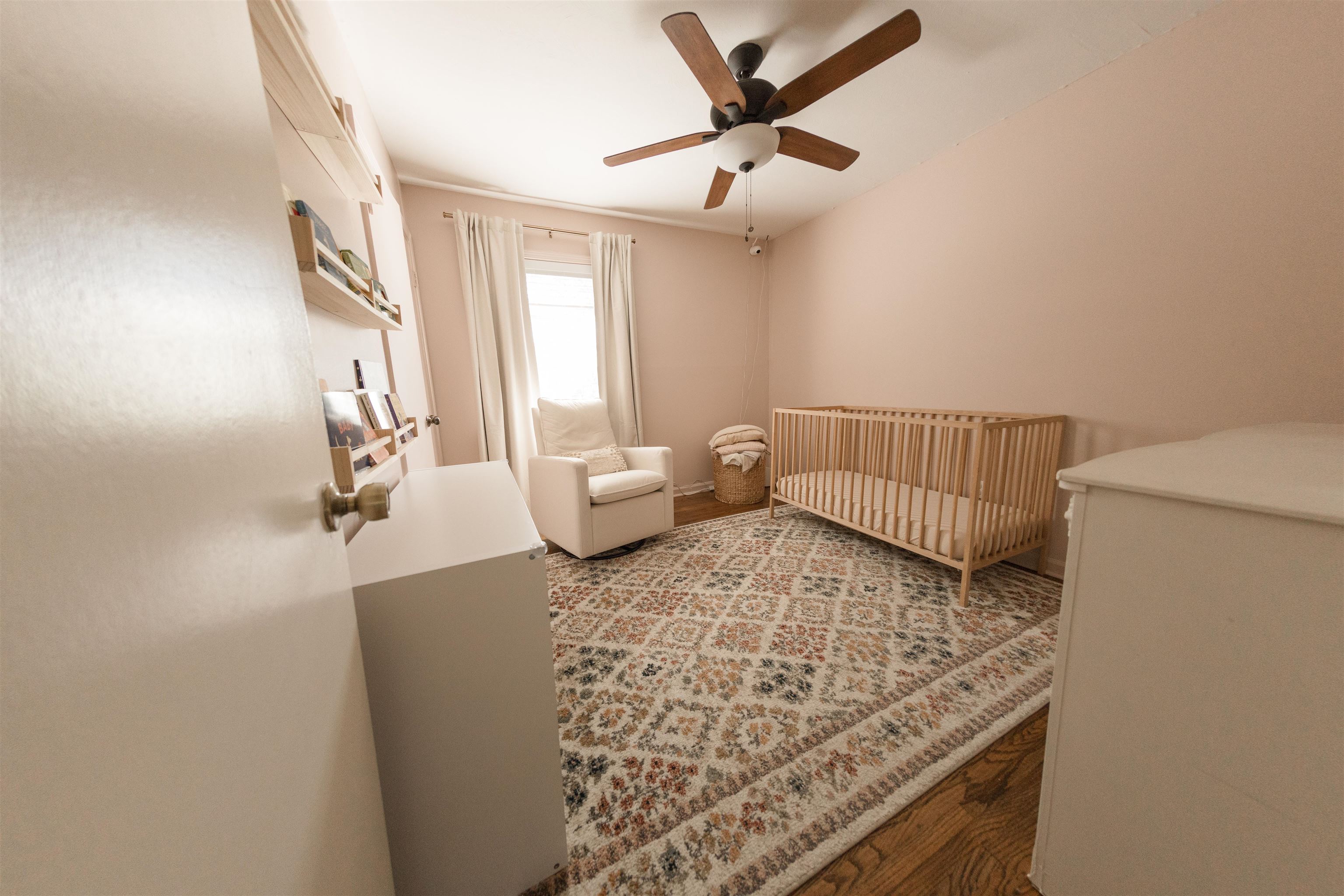 5431 Quince Road Memphis, TN 38119 - Photo 14 of 21 a living room with a couch and a chandelier