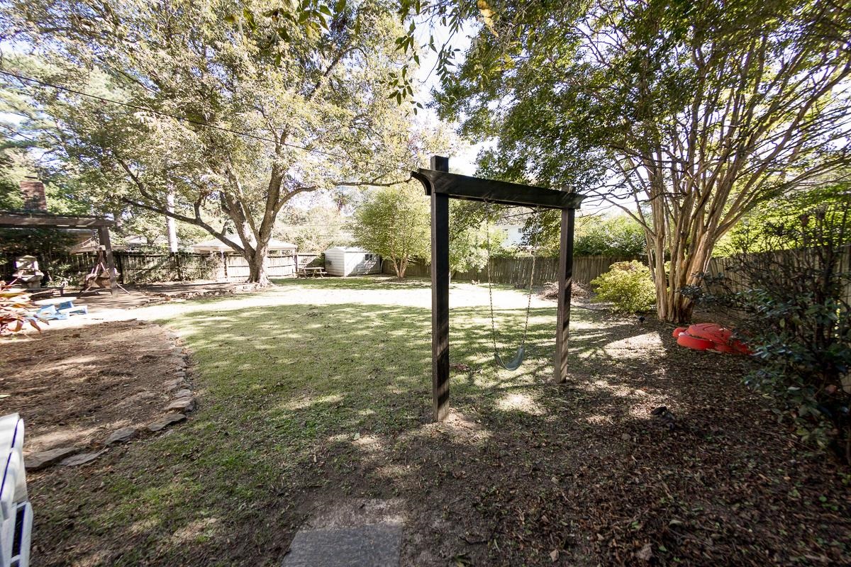 5431 Quince Road Memphis, TN 38119 - Photo 18 of 21 a view of a yard with plants and trees
