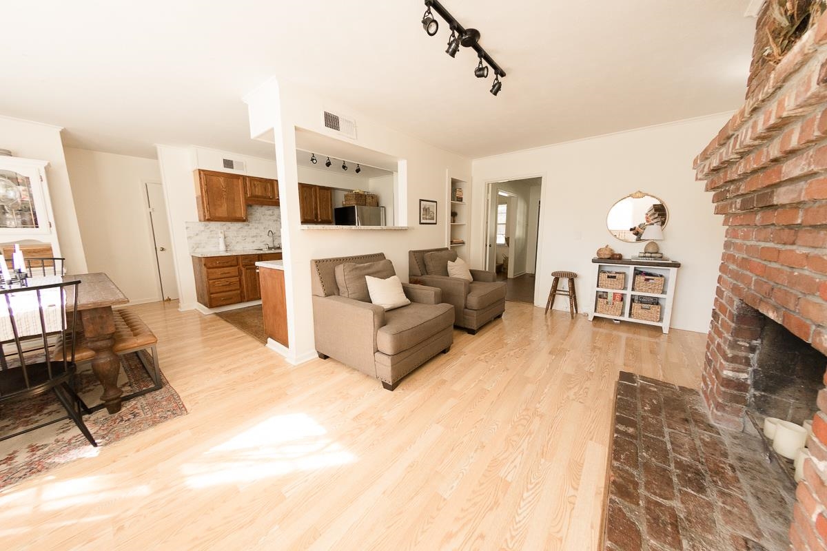 5431 Quince Road Memphis, TN 38119 - Photo 6 of 21 a living room with furniture and a fireplace