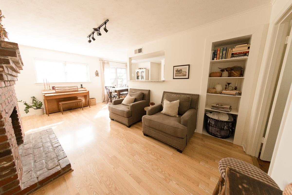 5431 Quince Road Memphis, TN 38119 - Photo 7 of 21 a living room with furniture and a flat screen tv