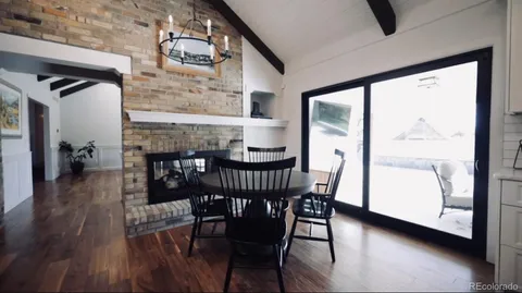 a living room with furniture and a mirror