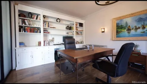 a bedroom with a bed and a television