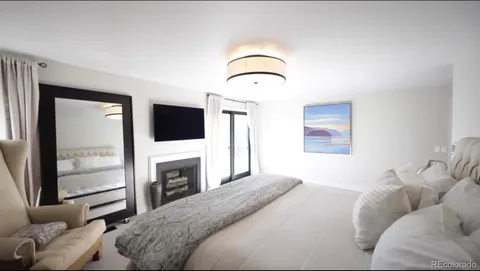 a en suite bathroom with a double vanity sink and a mirror