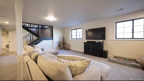a kitchen with a sink and a refrigerator