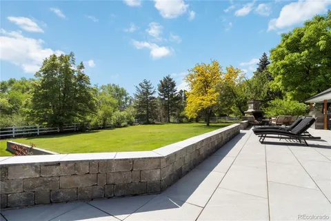 a view of a house with backyard and chair