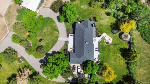 a view of ocean with a table and chairs
