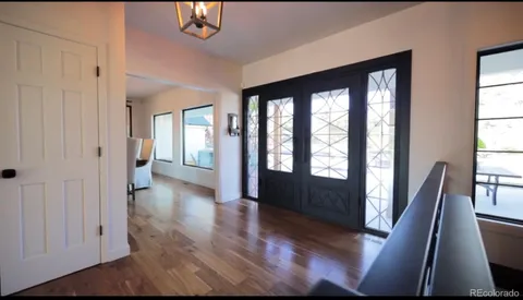 a living room with fireplace furniture and a flat screen tv