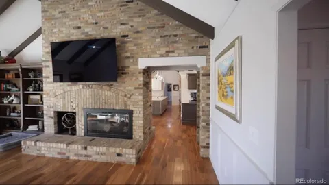 a kitchen with stainless steel appliances kitchen island granite countertop a refrigerator and a stove