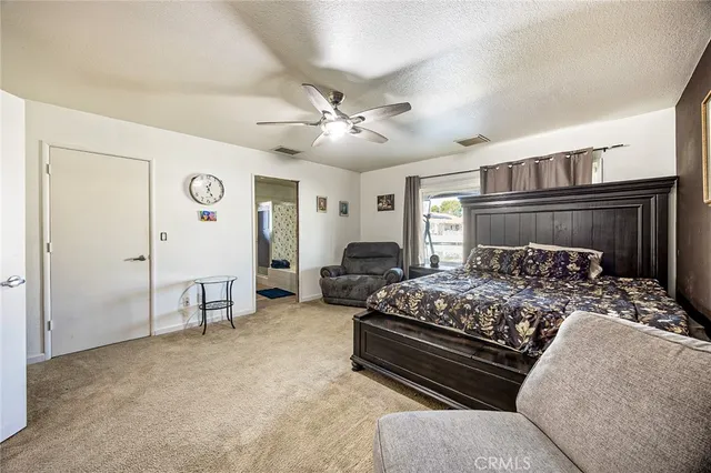 a bedroom with bed and window