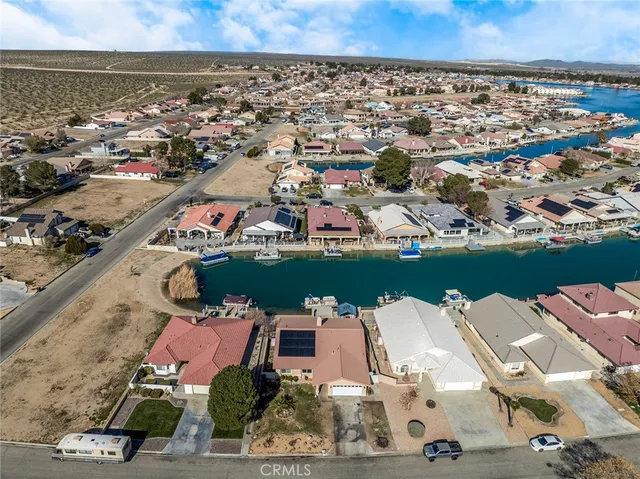 an aerial view of a house with a ocean view