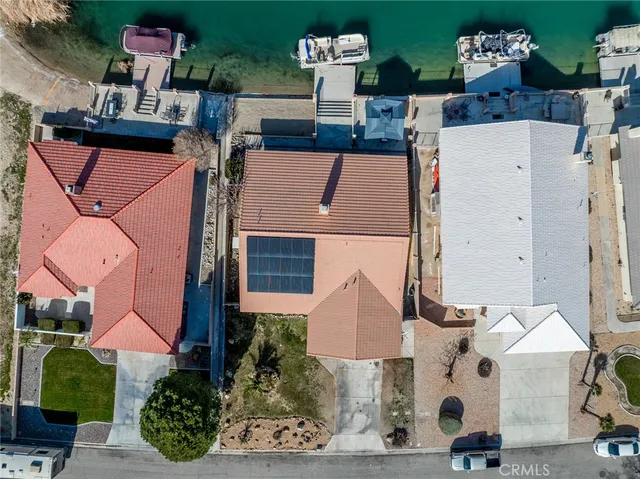 an aerial view of residential houses with outdoor space