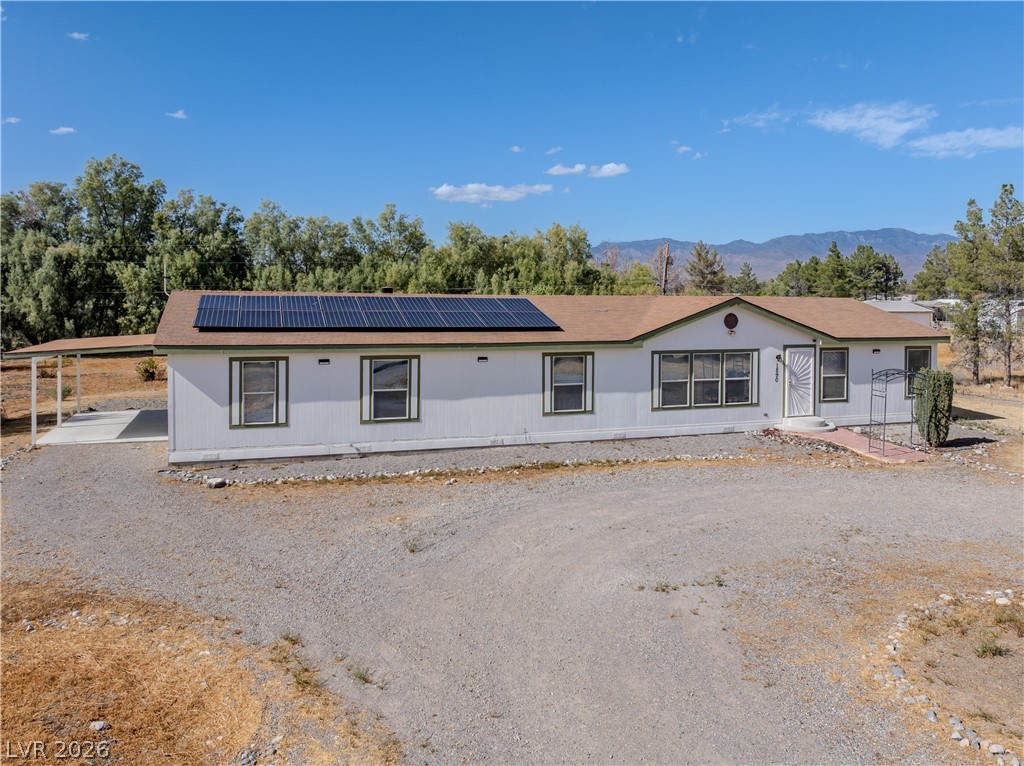1890 West Dyer Road Pahrump, NV 89048 - Photo 1 of 40 This home offers energy efficiency and comfortable living with a well-maintained exterior.