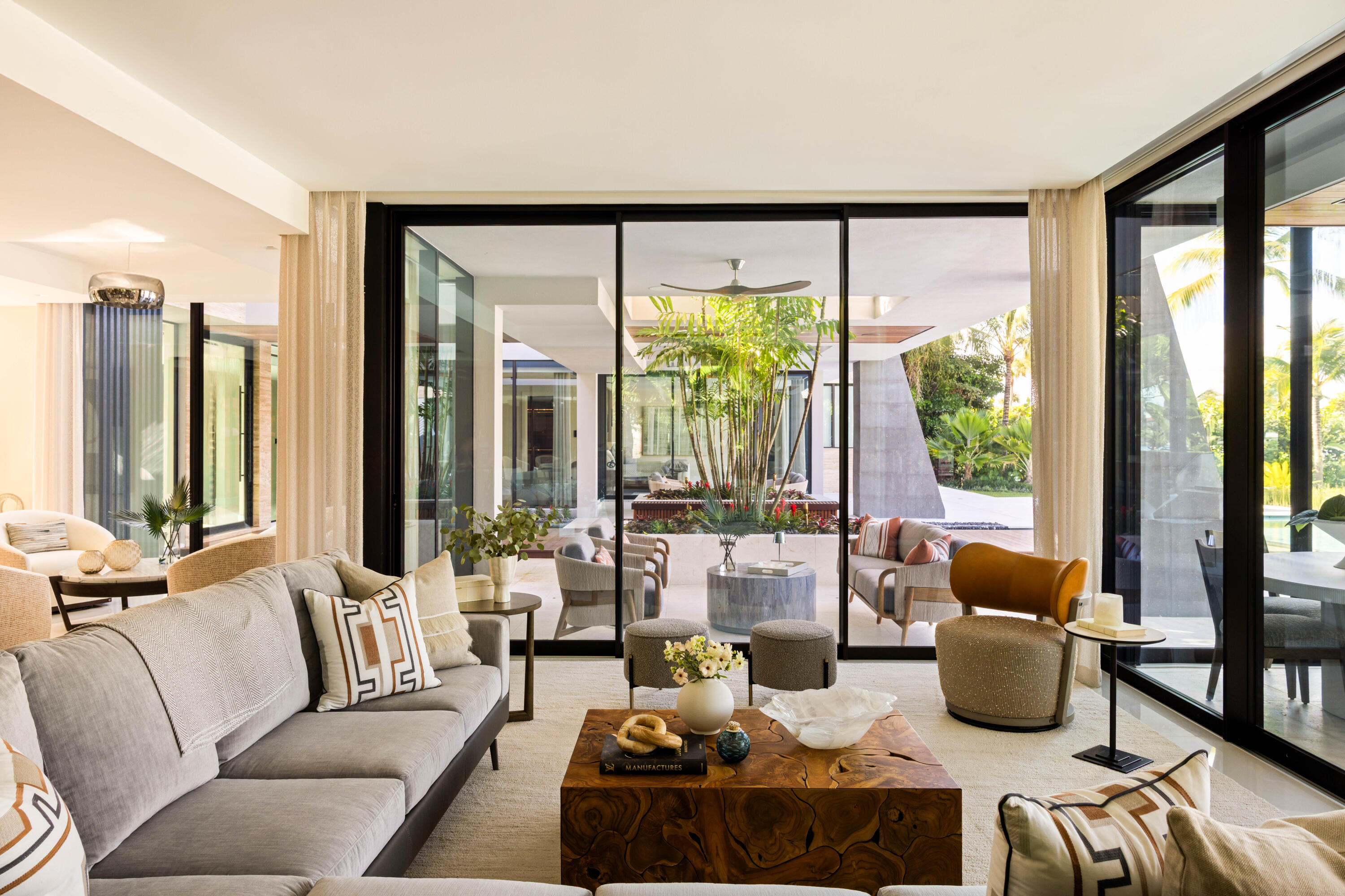 488 South Beach Road Jupiter Island, FL 33455 - Photo 13 of 54 a living room with furniture and a large window