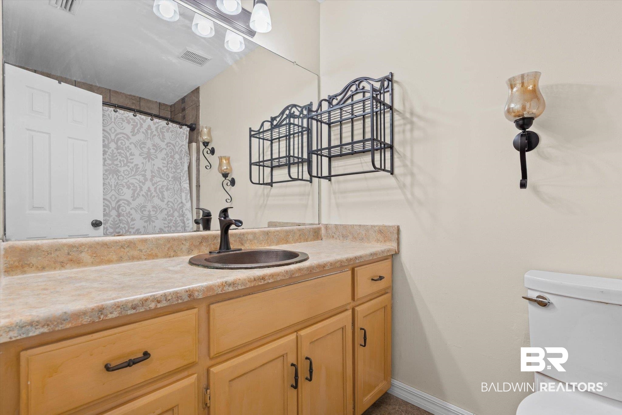 180 Creax Road Axis, AL 36505 - Photo 16 of 35 Full bathroom featuring curtained shower and vanity