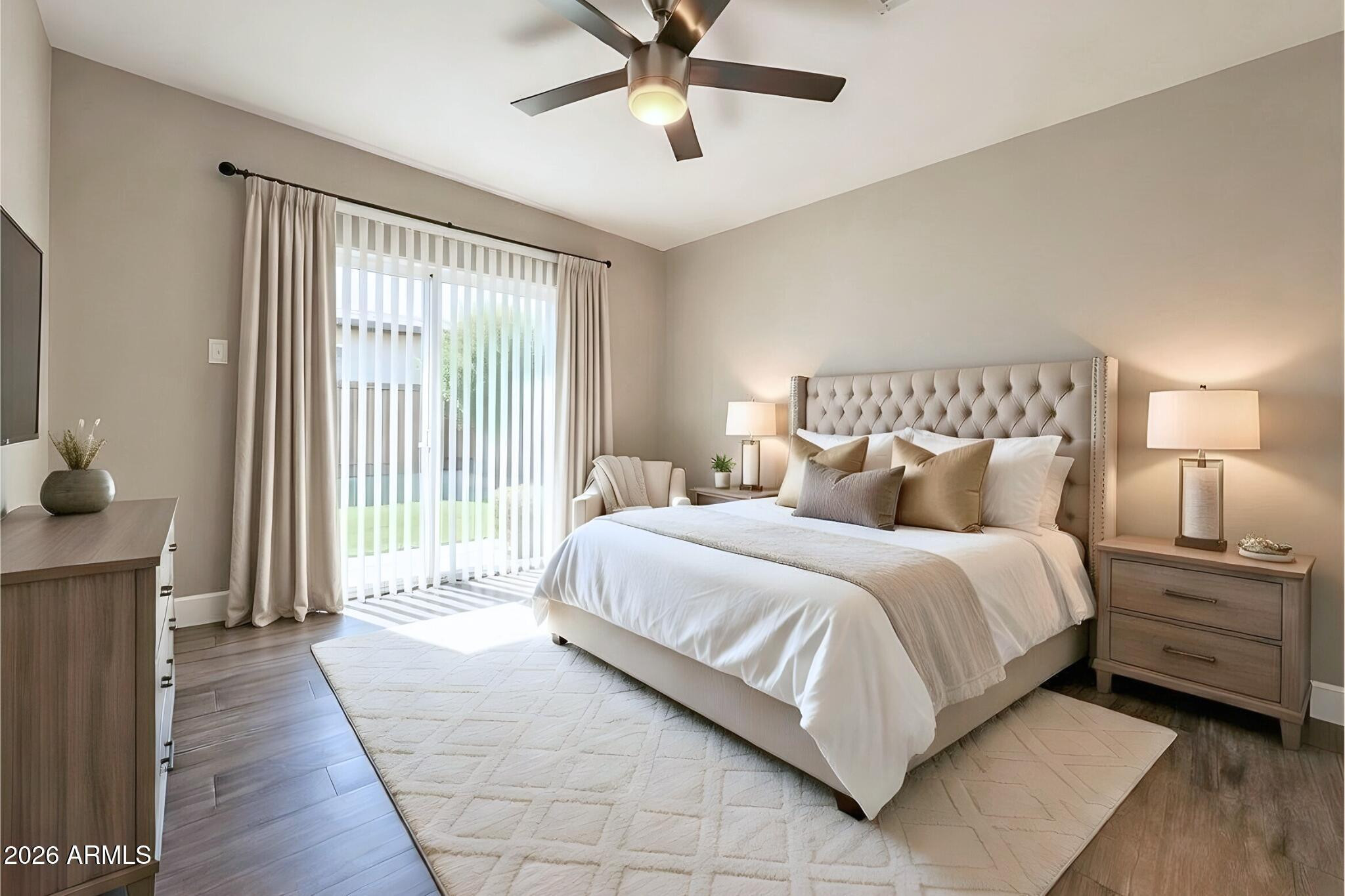 550 West 9th Street, Unit 2 Mesa, AZ 85201 - Photo 7 of 10 a spacious bedroom with a bed and a chandelier