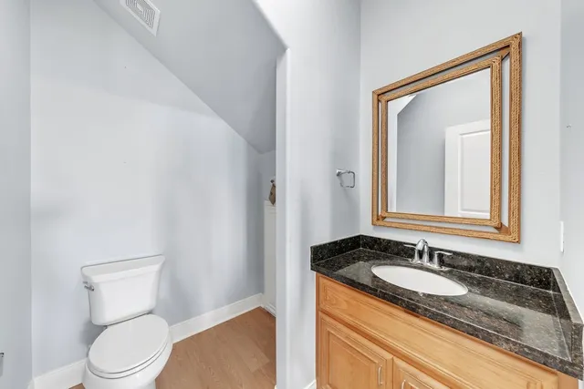 a view of a room with shelves on the wall