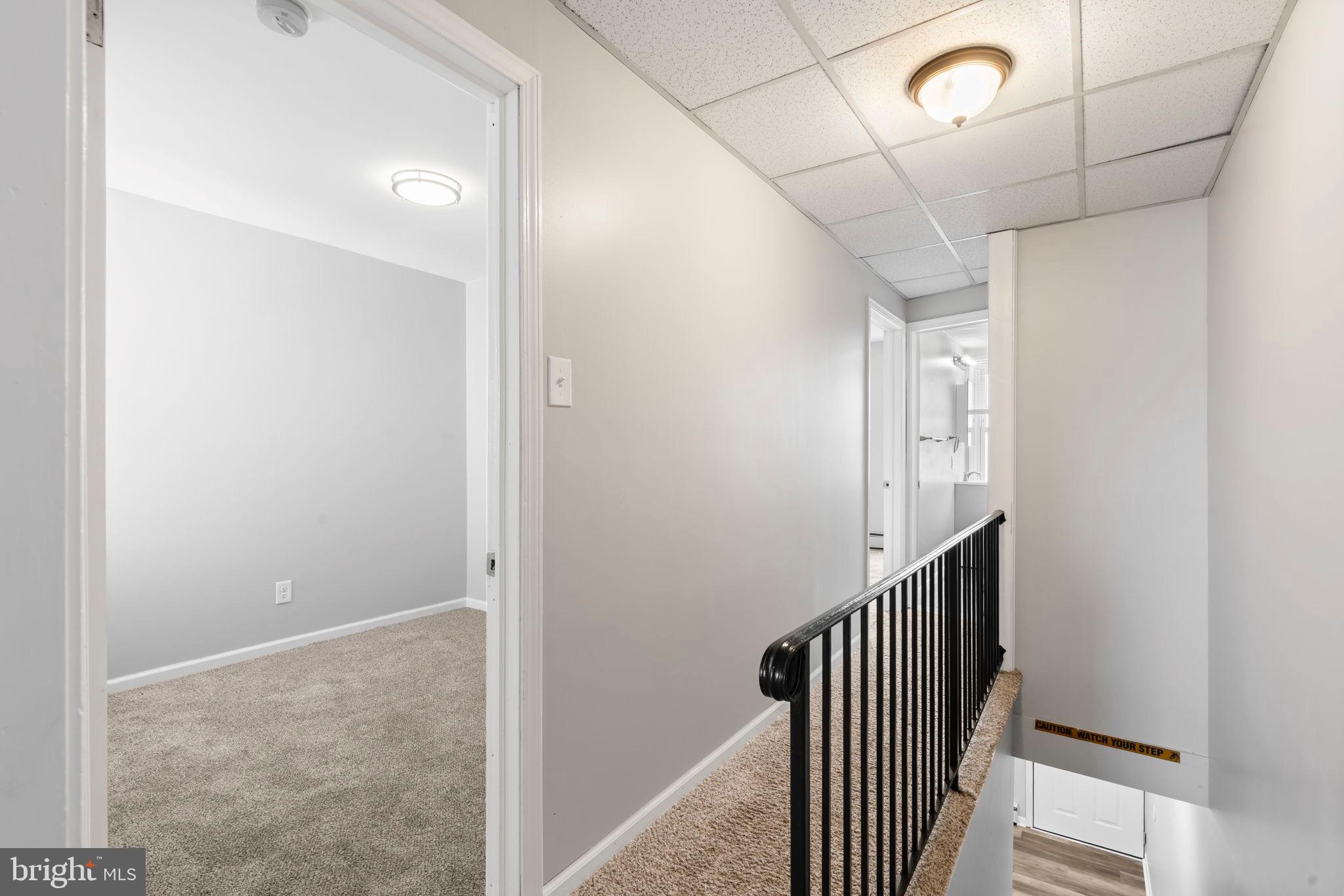 1363 Green Street Marcus Hook, PA 19061 - Photo 15 of 26 a view of a hallway with wooden floor and staircase