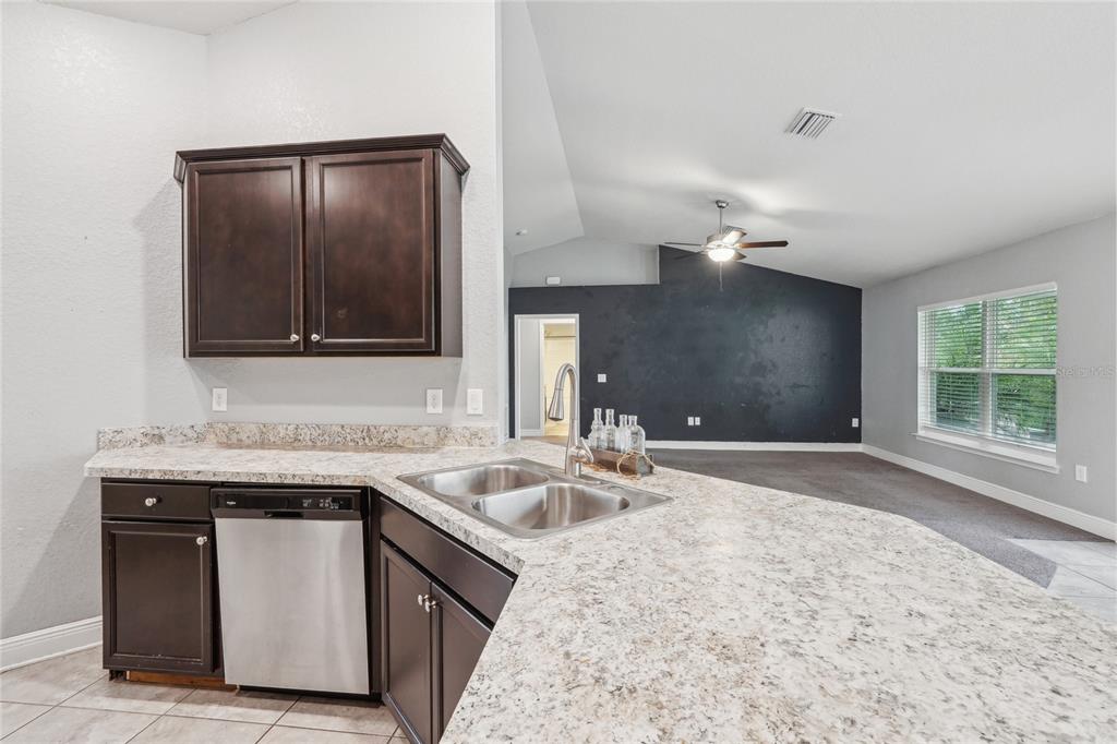 5134 Jenson Avenue Spring Hill, FL 34608 - Photo 16 of 49 a kitchen with a sink and a window