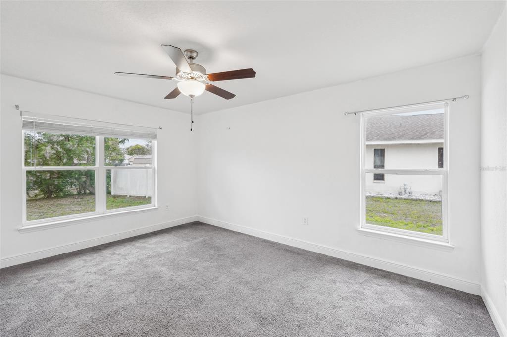 5134 Jenson Avenue Spring Hill, FL 34608 - Photo 19 of 49 a view of an empty room with a window