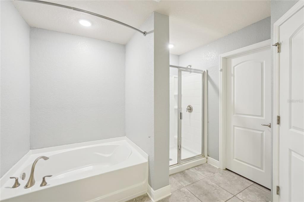 5134 Jenson Avenue Spring Hill, FL 34608 - Photo 22 of 49 a bathroom with a tub shower and a sink