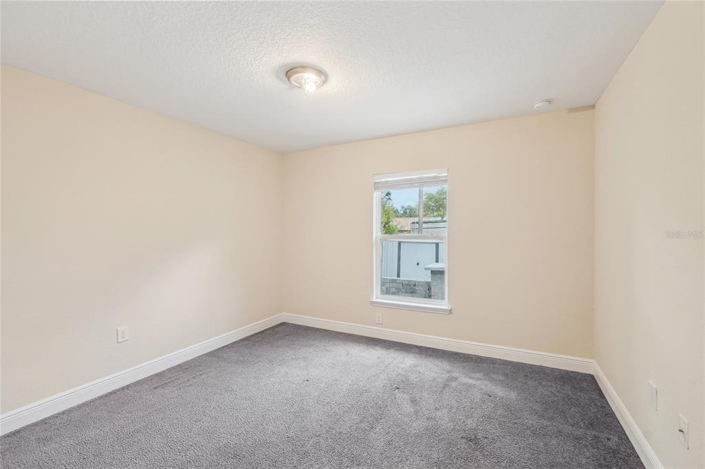 5134 Jenson Avenue Spring Hill, FL 34608 - Photo 25 of 49 an empty room with a window