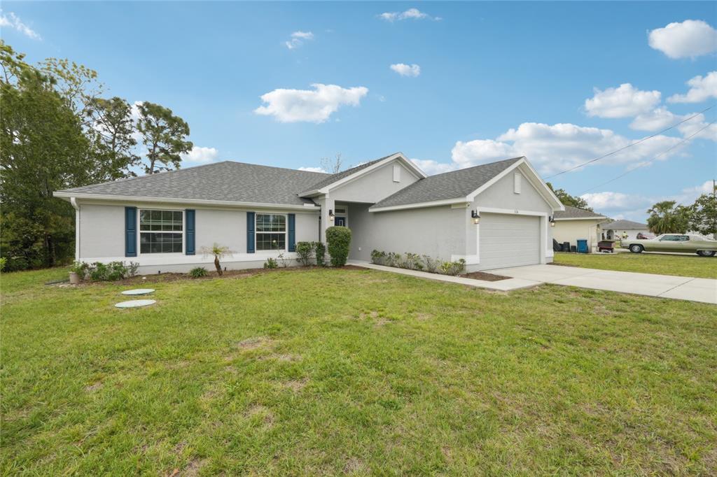 5134 Jenson Avenue Spring Hill, FL 34608 - Photo 3 of 49 a view of a house with a backyard