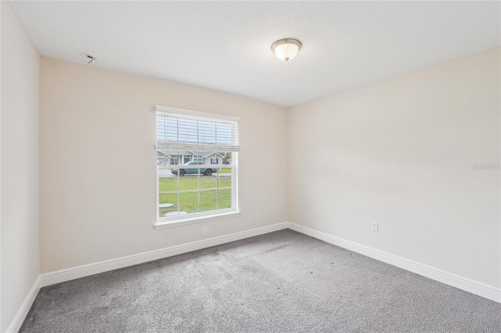 5134 Jenson Avenue Spring Hill, FL 34608 - Photo 31 of 49 an empty room with a window