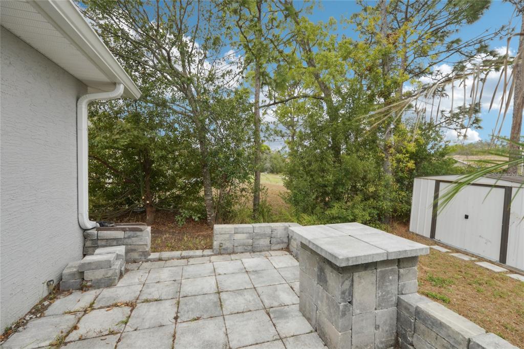 5134 Jenson Avenue Spring Hill, FL 34608 - Photo 35 of 49 a view of a yard with an outdoor space