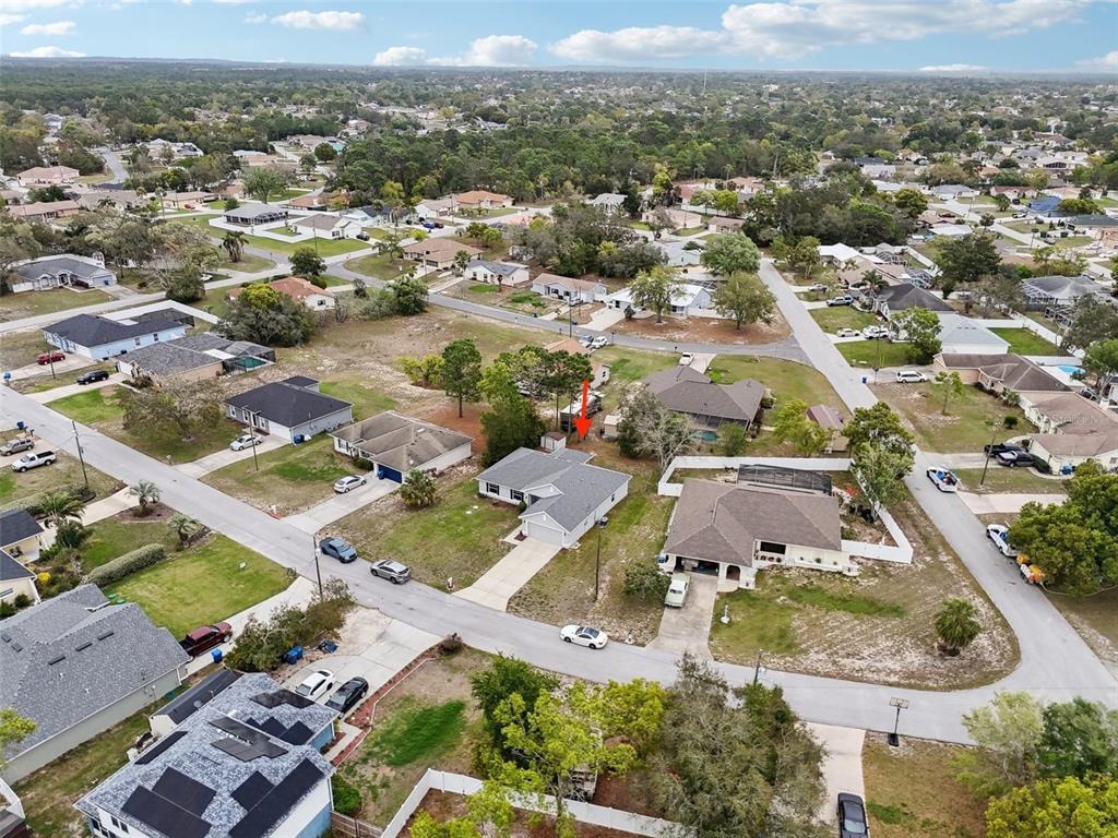 5134 Jenson Avenue Spring Hill, FL 34608 - Photo 43 of 49 an aerial view of residential houses with outdoor space