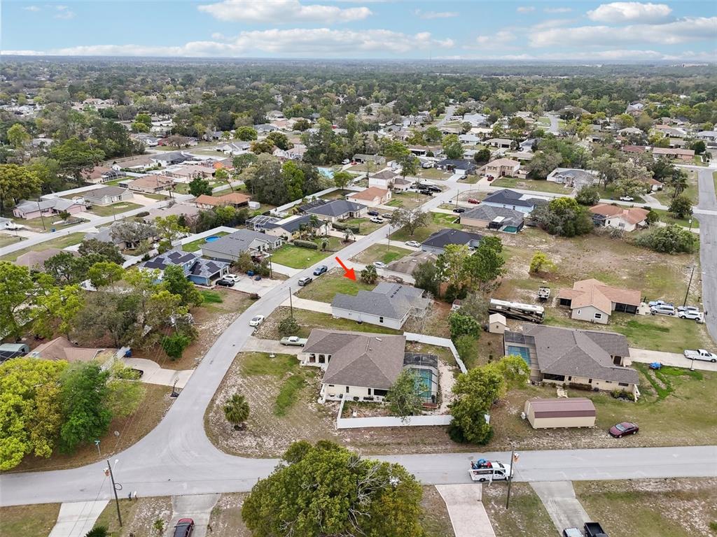 5134 Jenson Avenue Spring Hill, FL 34608 - Photo 44 of 49 an aerial view of residential houses with outdoor space