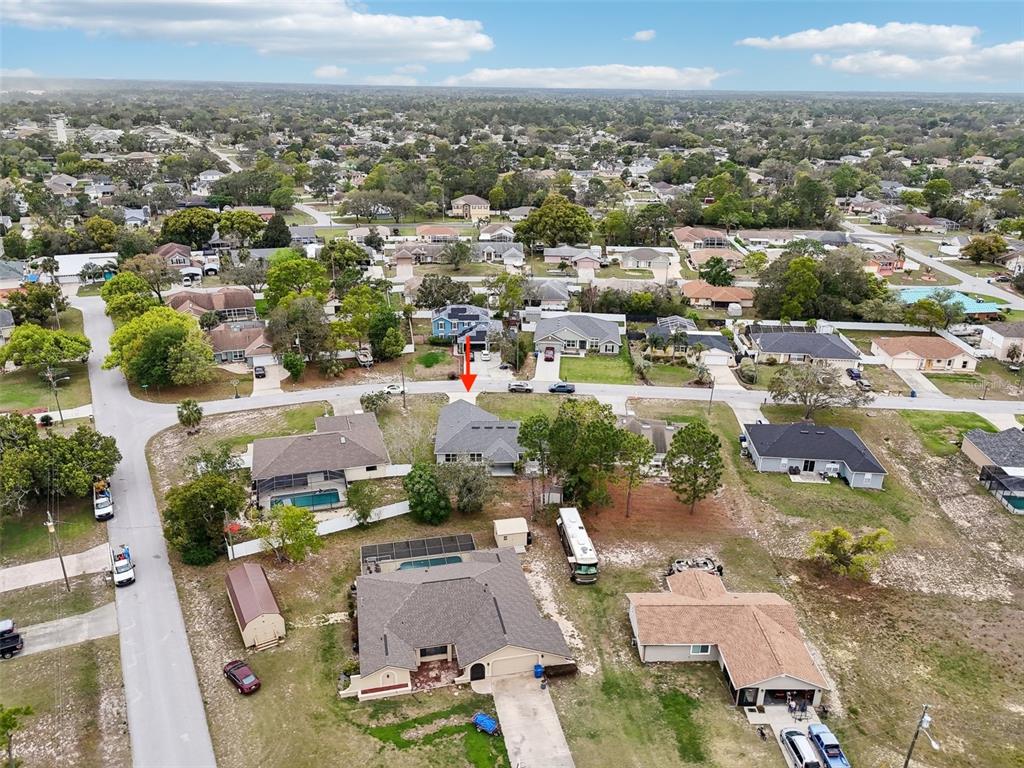 5134 Jenson Avenue Spring Hill, FL 34608 - Photo 46 of 49 an aerial view of residential houses with outdoor space
