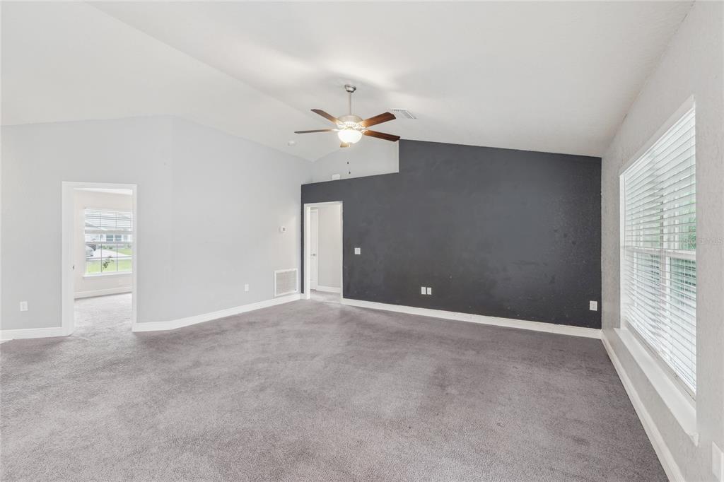 5134 Jenson Avenue Spring Hill, FL 34608 - Photo 8 of 49 an empty room with fan and windows