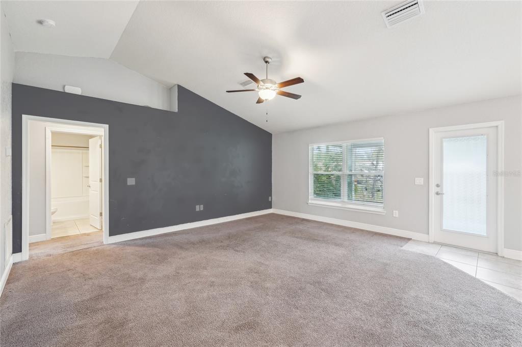 5134 Jenson Avenue Spring Hill, FL 34608 - Photo 9 of 49 a view of an empty room with a window