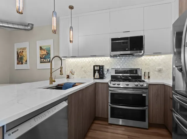 a kitchen with a stove and a sink
