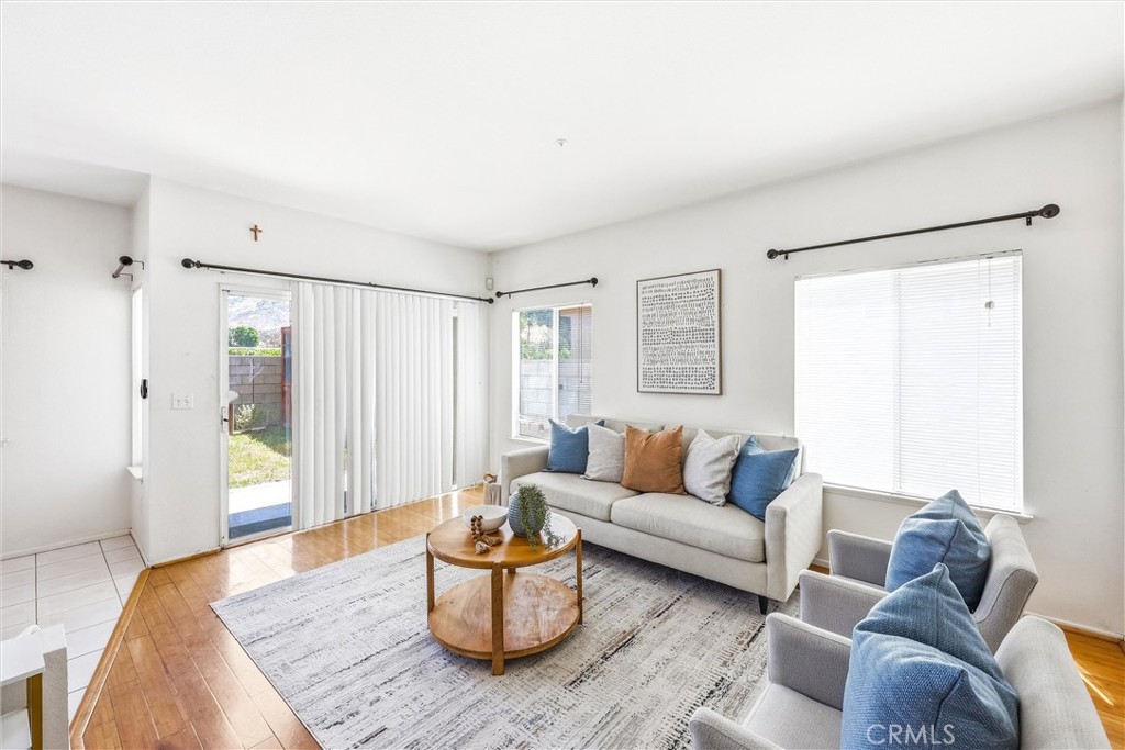 11453 Plane Tree Road Fontana, CA 92337 - Photo 20 of 40 a living room with furniture and a wooden floor