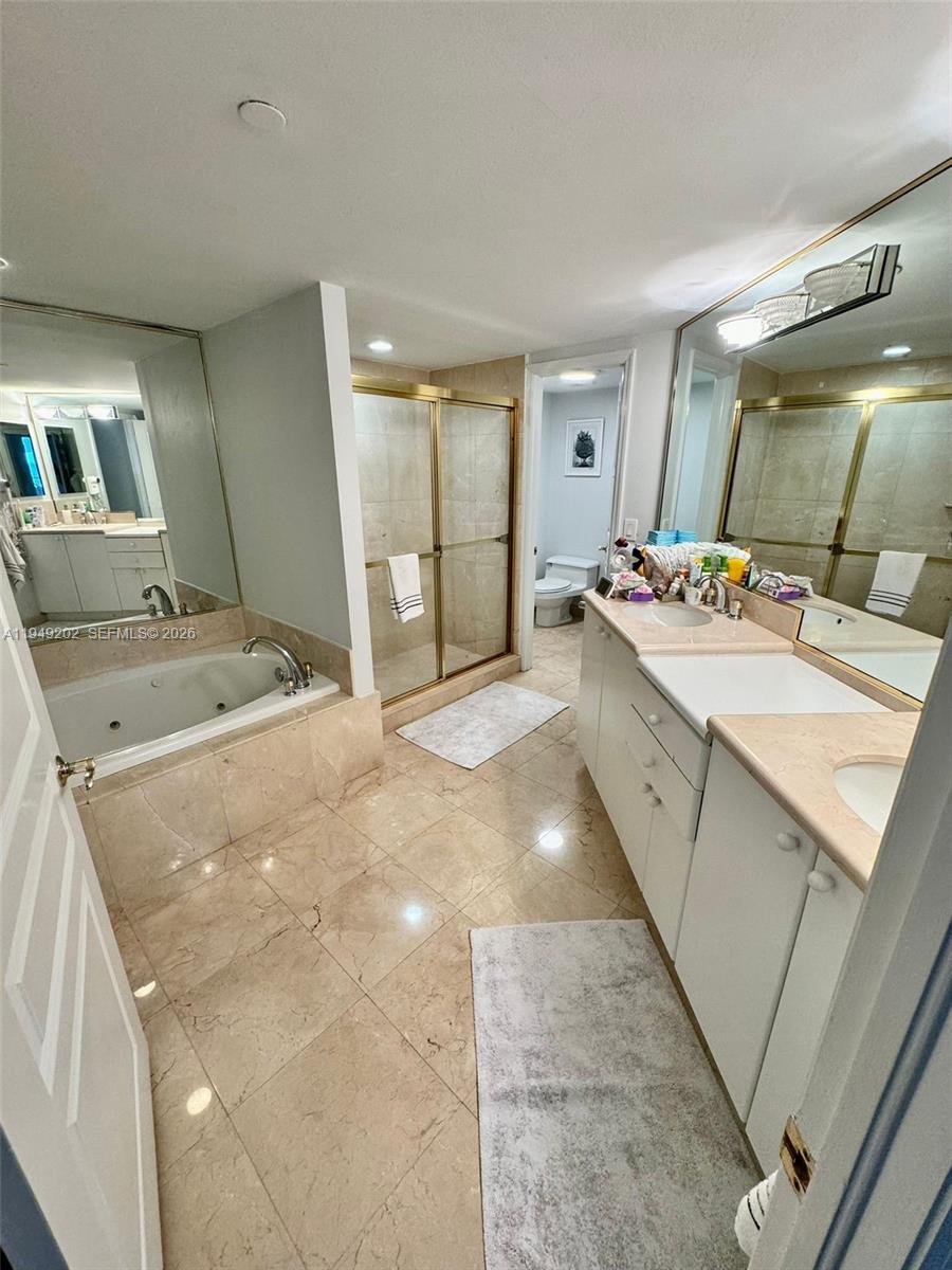 8925 Collins Avenue, Unit 9G Surfside, FL 33154 - Photo 5 of 17 a room with a washing machine and sink