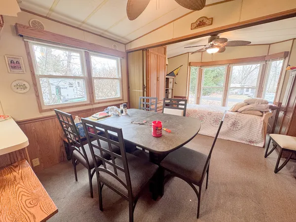 a dining room with furniture and windows