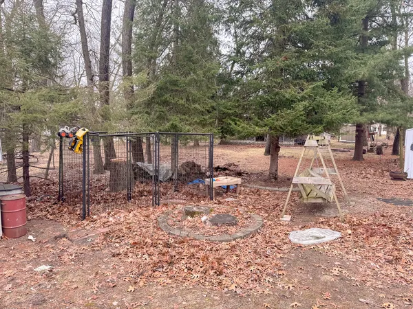 a view of backyard with a table and chairs