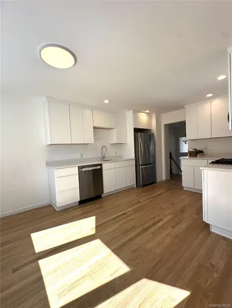 a kitchen with stainless steel appliances granite countertop a refrigerator sink and cabinets