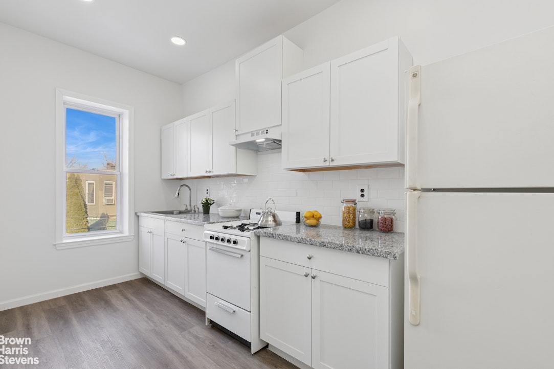 251 Rutland Road Brooklyn, NY 11225 - Photo 6 of 16 a kitchen with stainless steel appliances granite countertop a sink stove and cabinets