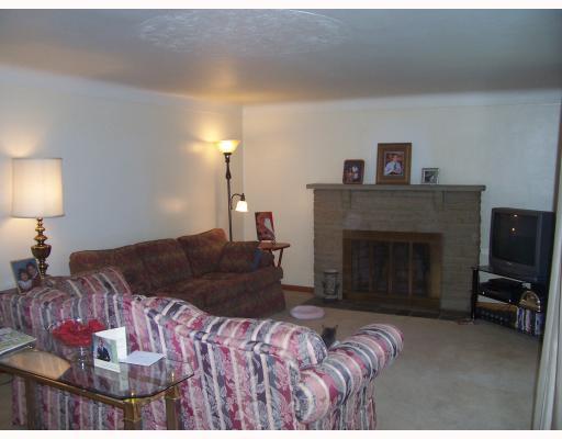 2443 Haymaker Road Monroeville, PA 15146 - Photo 4 of 9 Living Room. Warm and inviting living room with stone fireplace.