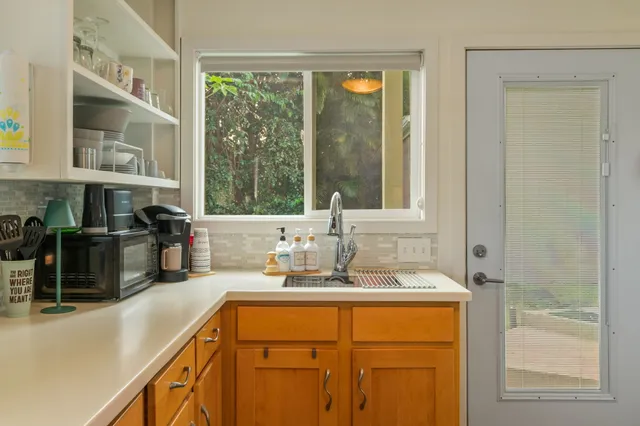 a bathroom with a sink double vanity and a mirror